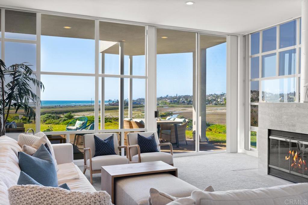 170 Solana Point Circle Solana Beach, CA 92075 - Photo 28 of 68 a living room with furniture and a floor to ceiling window