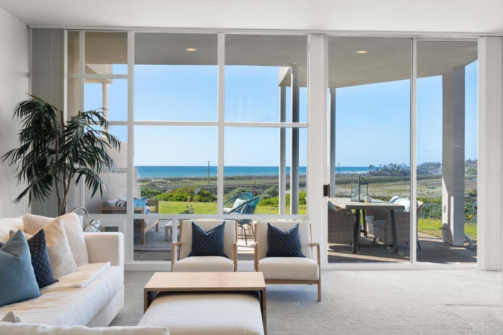 170 Solana Point Circle Solana Beach, CA 92075 - Photo 30 of 68 a living room with furniture and a large window