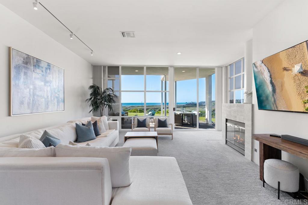 170 Solana Point Circle Solana Beach, CA 92075 - Photo 34 of 68 a living room with furniture and a fireplace