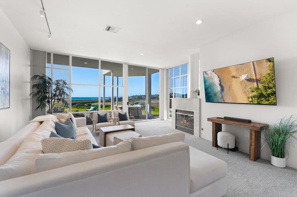 170 Solana Point Circle Solana Beach, CA 92075 - Photo 38 of 68 a living room with furniture and a fireplace