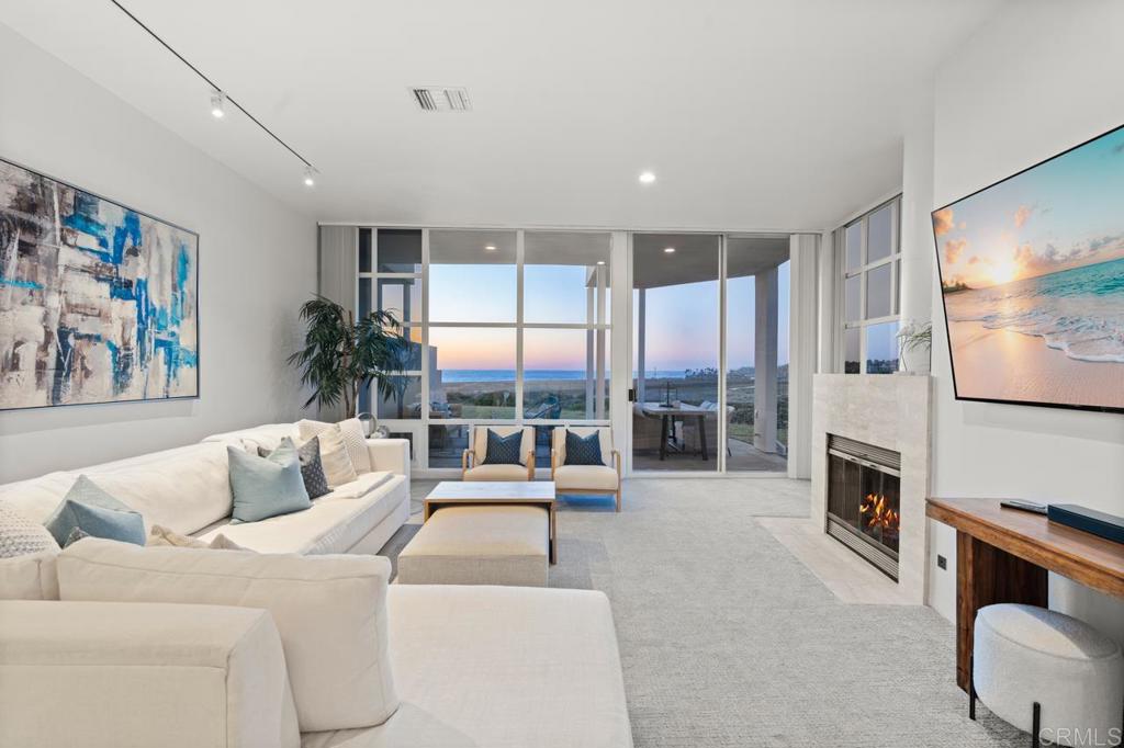 170 Solana Point Circle Solana Beach, CA 92075 - Photo 39 of 68 a living room with furniture and a flat screen tv