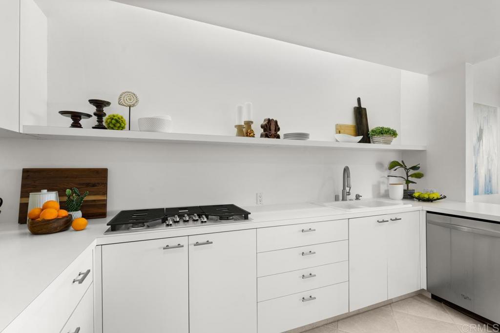 170 Solana Point Circle Solana Beach, CA 92075 - Photo 47 of 68 a kitchen with white cabinets and white appliances