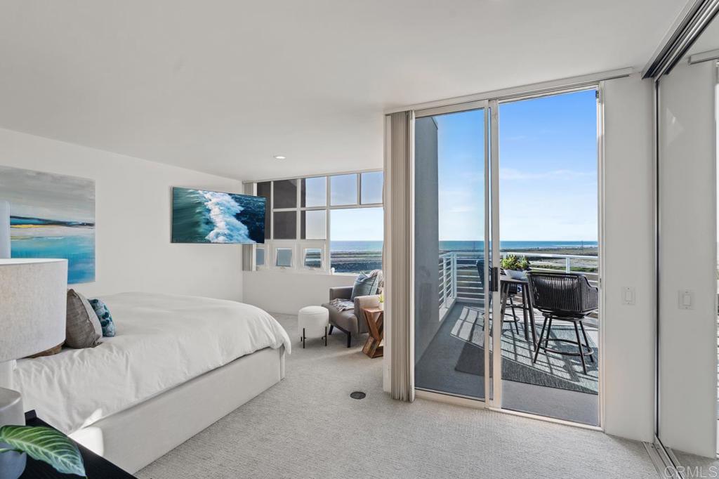 170 Solana Point Circle Solana Beach, CA 92075 - Photo 55 of 68 a bedroom with a bed and a mirror