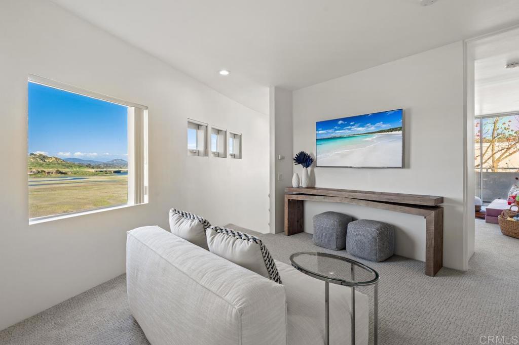 170 Solana Point Circle Solana Beach, CA 92075 - Photo 60 of 68 a living room with furniture and a window