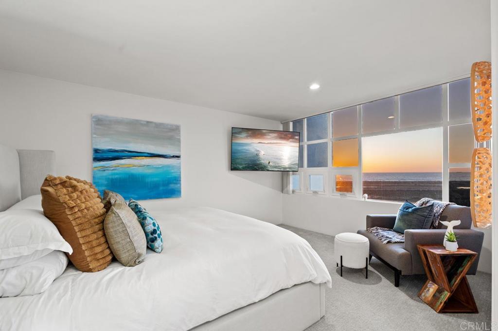 170 Solana Point Circle Solana Beach, CA 92075 - Photo 61 of 68 a bedroom with bed and glass wall