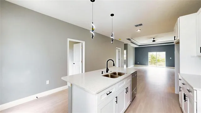 a kitchen with a sink and stove