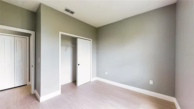 a view of room with window and ceiling fan