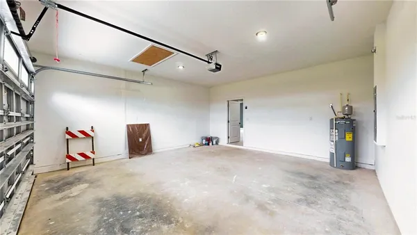 a view of hallway with stairs and a chandelier