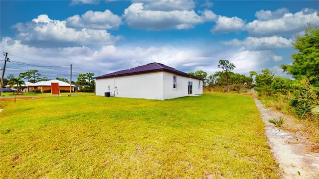 a view of an swimming pool with a yard