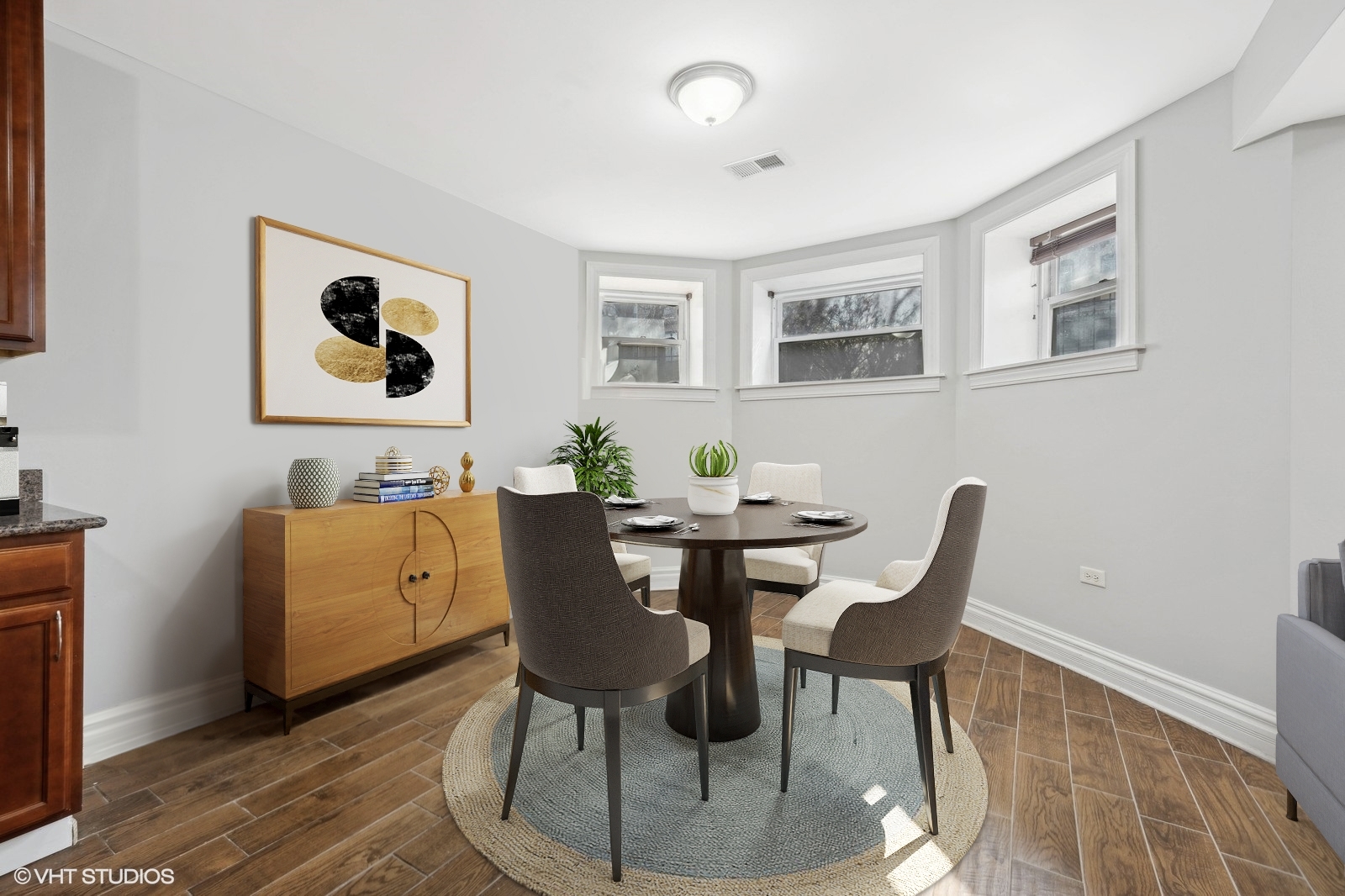 2256 West Adams Street, Unit G Chicago, IL 60612 - Photo 3 of 11 a view of a dining room with furniture and wooden floor