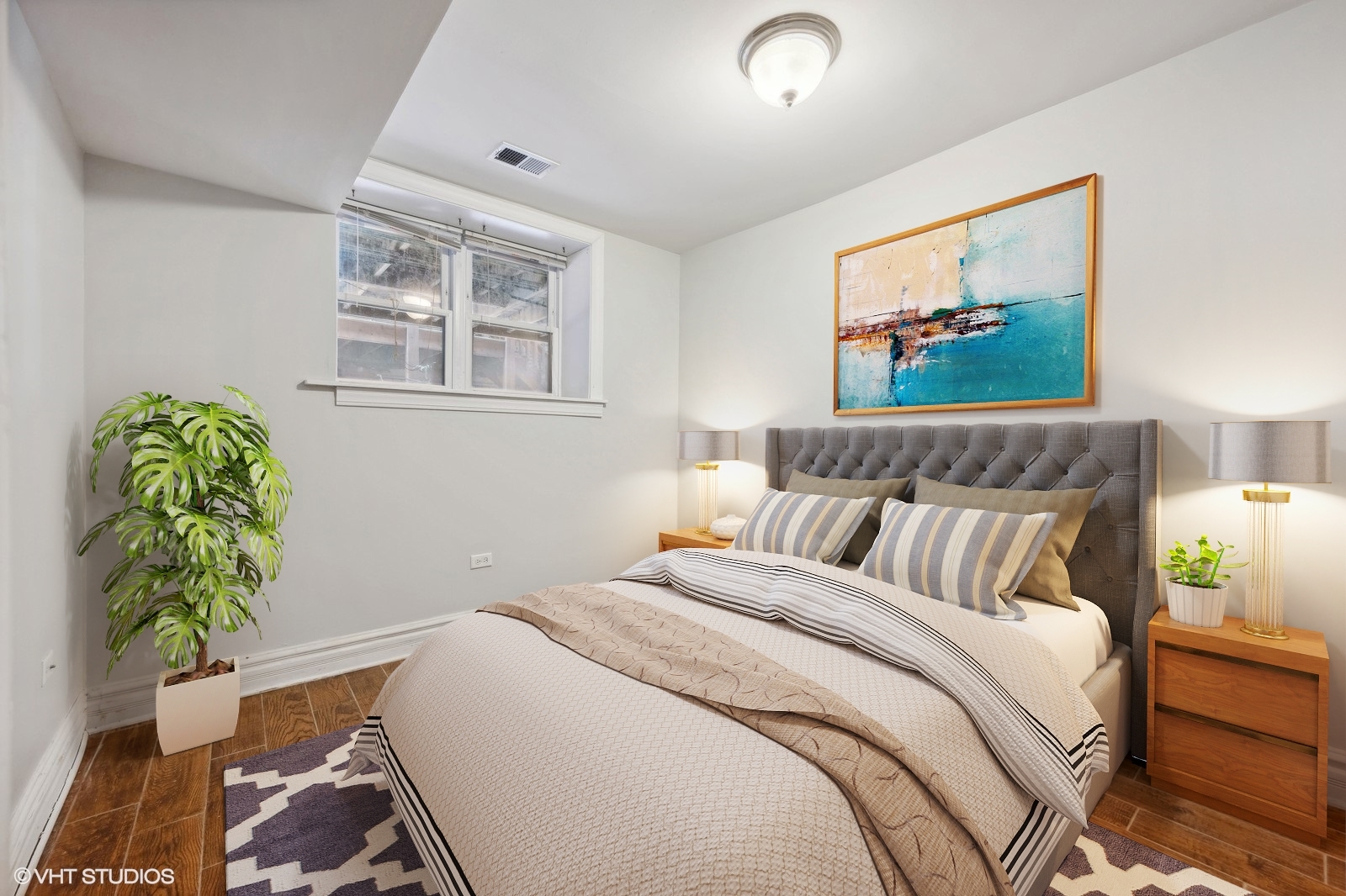 2256 West Adams Street, Unit G Chicago, IL 60612 - Photo 7 of 11 a bedroom with bed and a painting on the wall