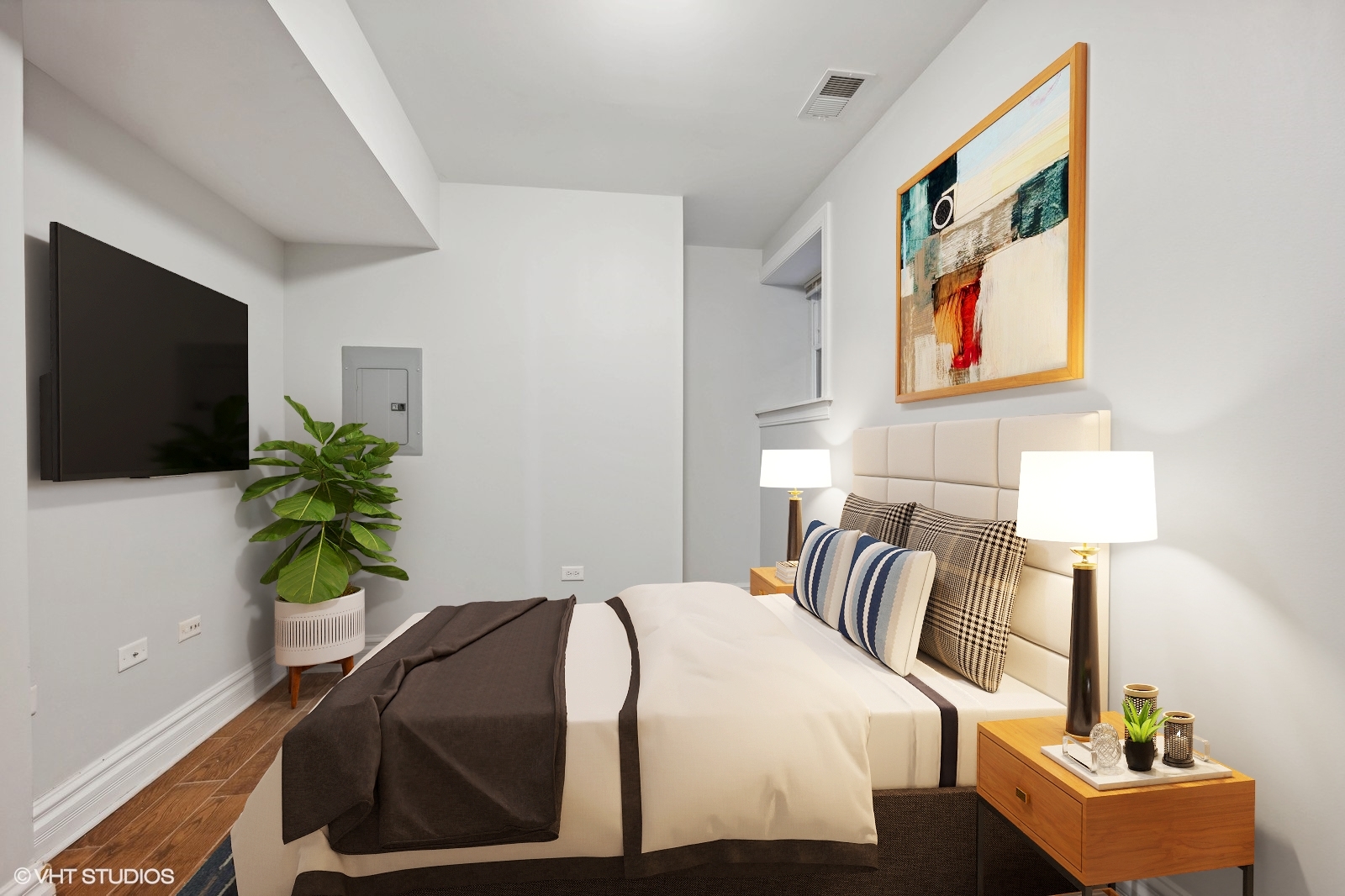 2256 West Adams Street, Unit G Chicago, IL 60612 - Photo 9 of 11 a bedroom with a bed and a flat screen tv