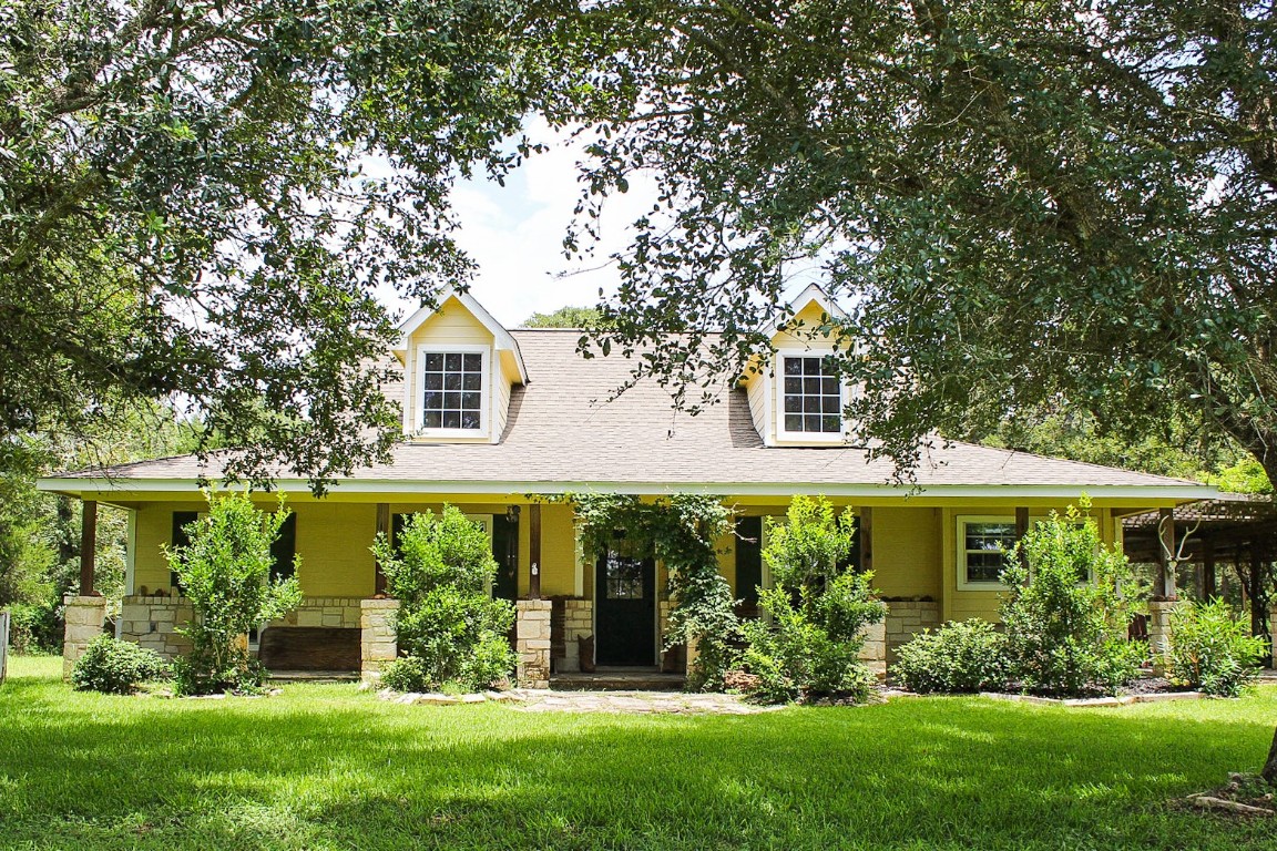 1076 West Branding Iron Road Weimar, TX 78962 - Photo 1 of 24 front view of a house with a yard