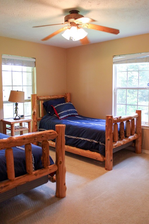 1076 West Branding Iron Road Weimar, TX 78962 - Photo 15 of 24 a bedroom with furniture and window
