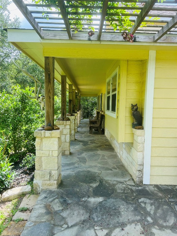 1076 West Branding Iron Road Weimar, TX 78962 - Photo 24 of 24 a view of a patio with table and chairs and potted plants