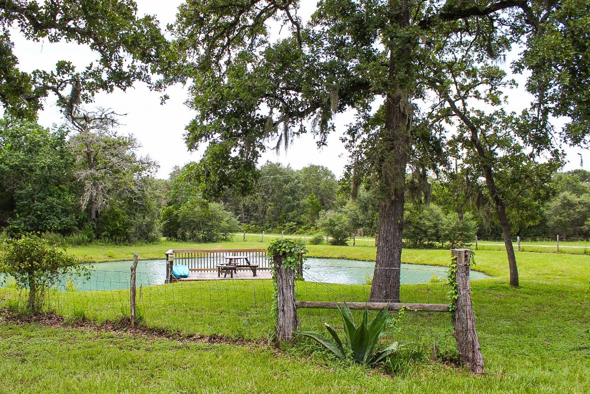 1076 West Branding Iron Road Weimar, TX 78962 - Photo 6 of 24 a view of a park with large trees