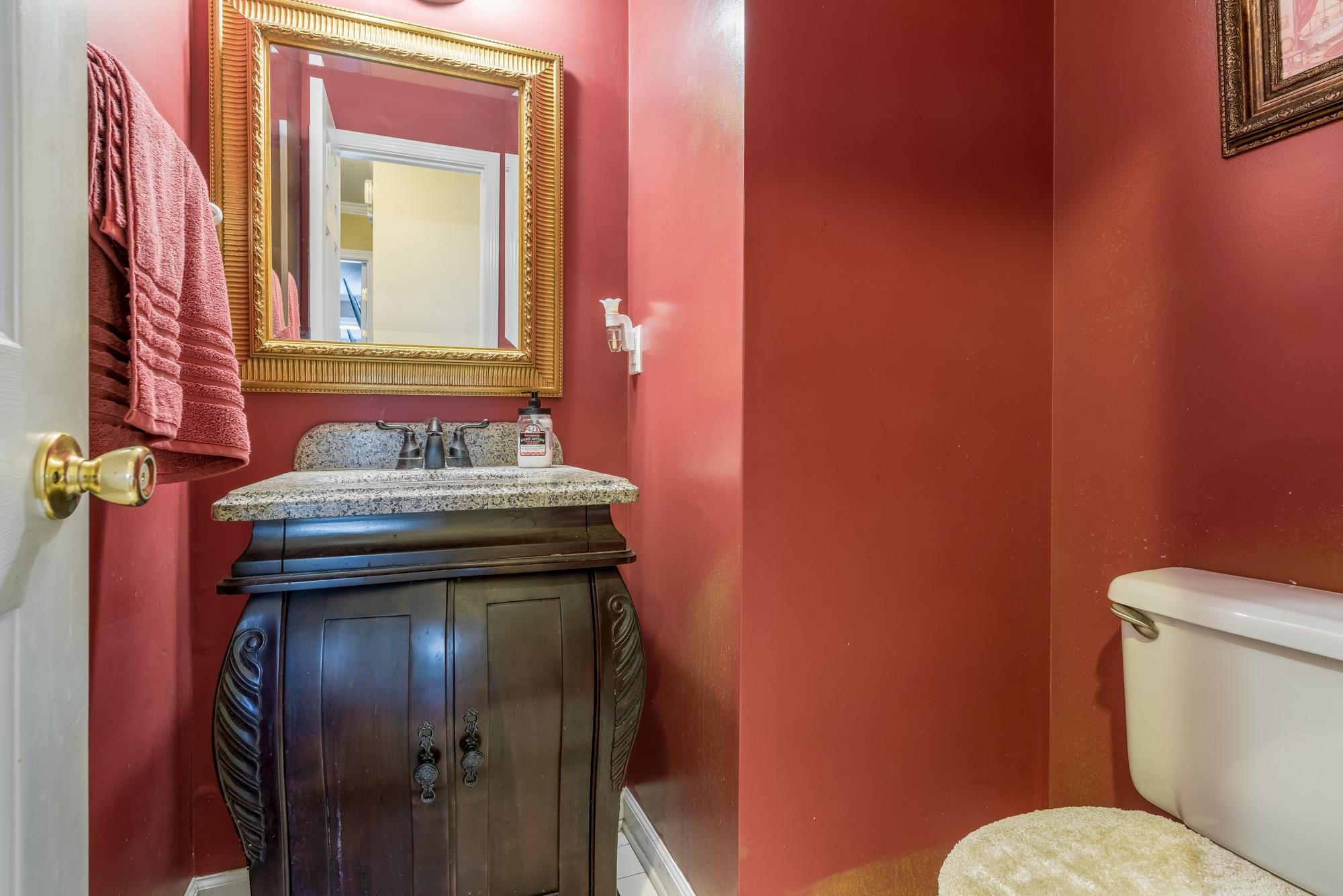 8599 Brer Fox Cove Memphis, TN 38018 - Photo 14 of 25 a bathroom with a toilet and a sink