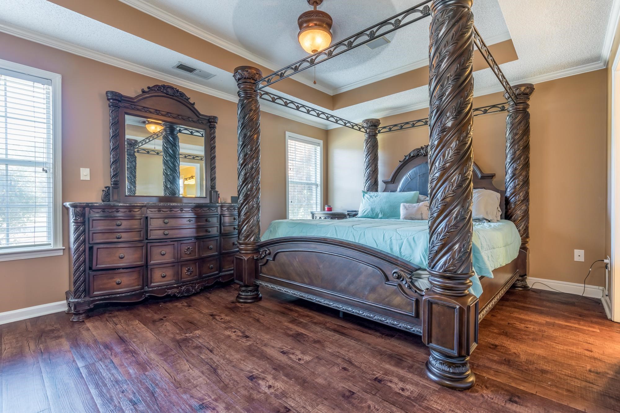 8599 Brer Fox Cove Memphis, TN 38018 - Photo 16 of 25 a bedroom with a bed window and a mirror