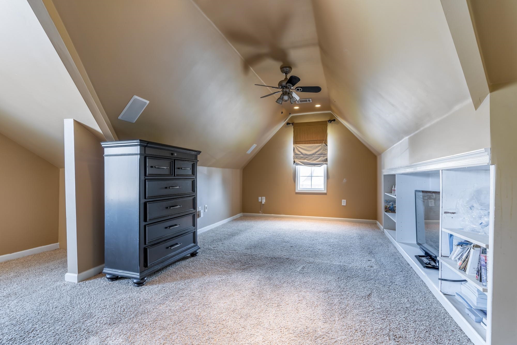 8599 Brer Fox Cove Memphis, TN 38018 - Photo 21 of 25 a view of a livingroom with a staircase