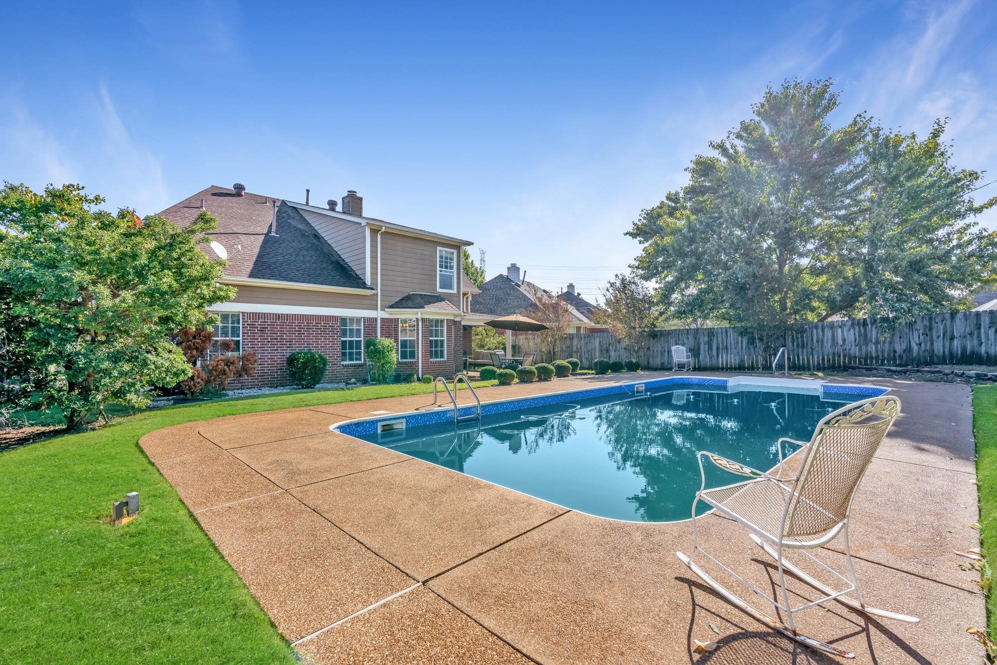 8599 Brer Fox Cove Memphis, TN 38018 - Photo 25 of 25 a view of a swimming pool with lounge chair