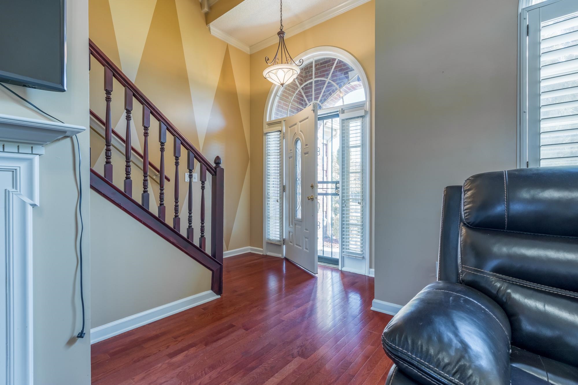 8599 Brer Fox Cove Memphis, TN 38018 - Photo 5 of 25 a view of livingroom with furniture window and wooden floor