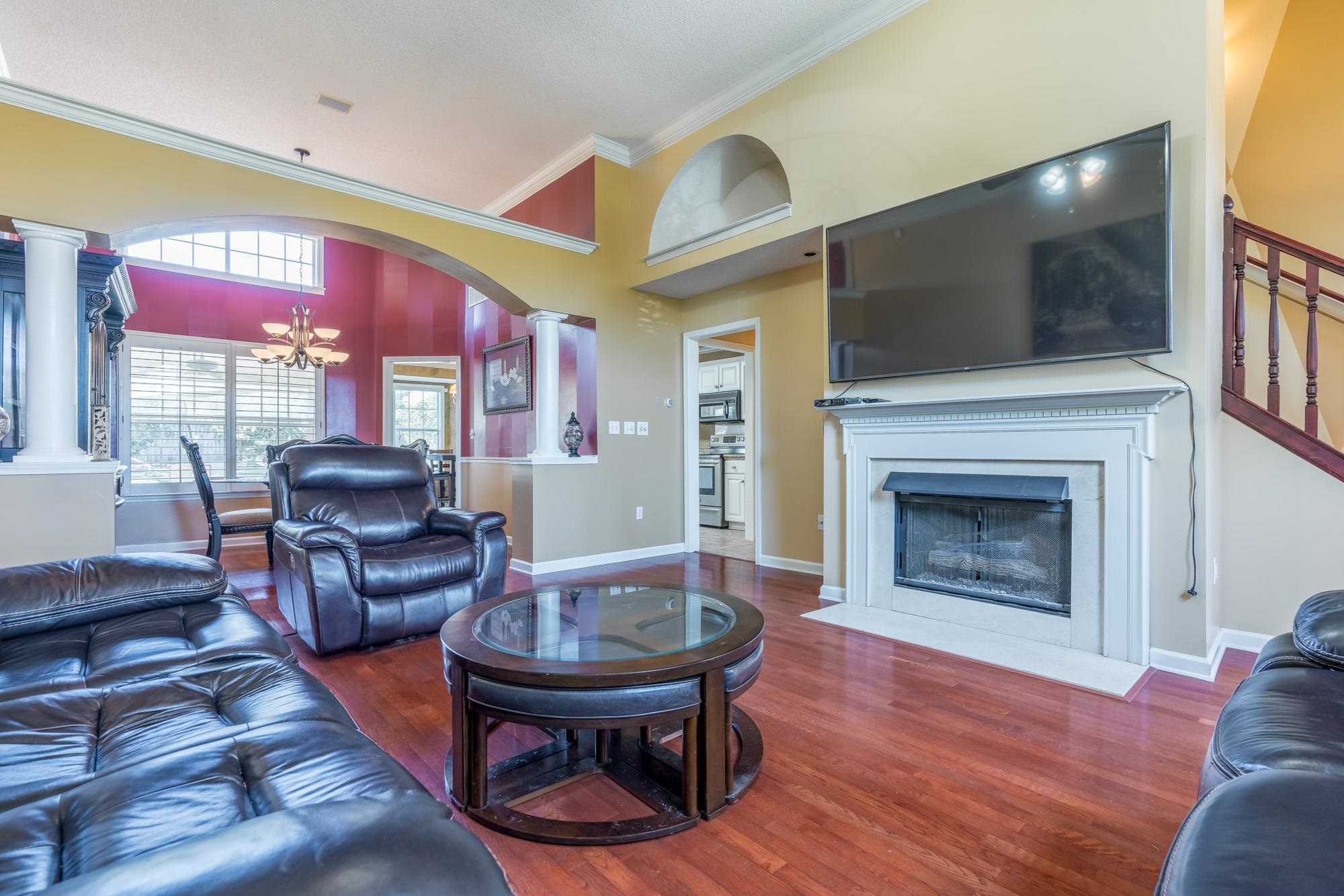 8599 Brer Fox Cove Memphis, TN 38018 - Photo 6 of 25 a living room with furniture and a fireplace