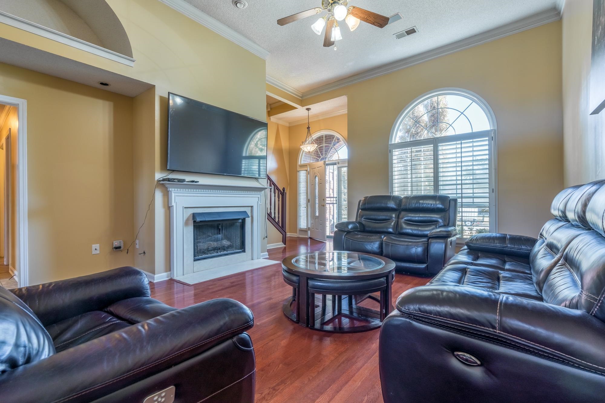 8599 Brer Fox Cove Memphis, TN 38018 - Photo 7 of 25 a living room with furniture fireplace and window