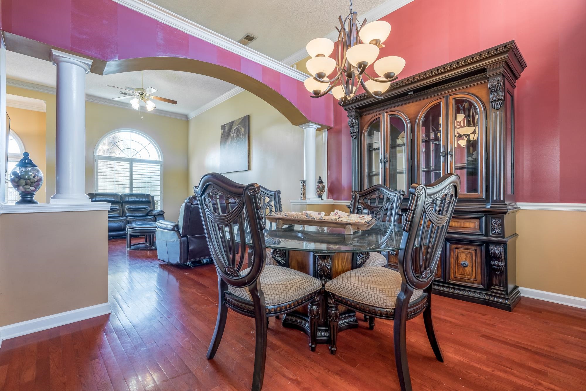 8599 Brer Fox Cove Memphis, TN 38018 - Photo 8 of 25 a view of a dining room with furniture and wooden floor