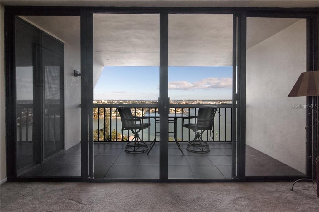 9425 Blind Pass Road, Unit 1202 St. Pete Beach, FL 33706 - Photo 1 of 1 Sliders lead to balcony with a 12th Floor View!