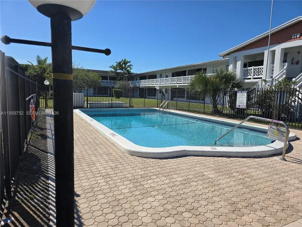 a view of a swimming pool with a patio