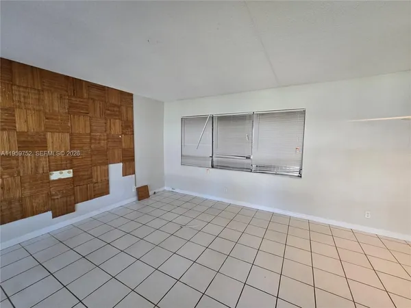 a view of an empty room and window