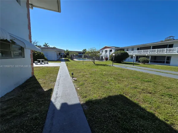 a view of a swimming pool with seating area