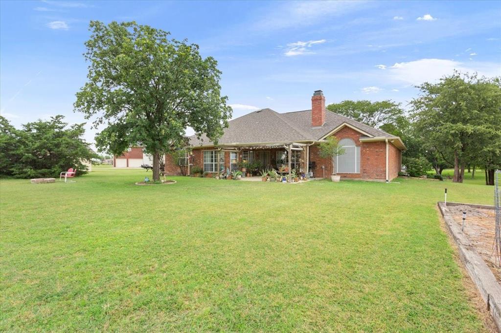 6008 Mesquite Tree Court Waco, TX 76708 - Photo 5 of 39 Open back yard with garden plot
