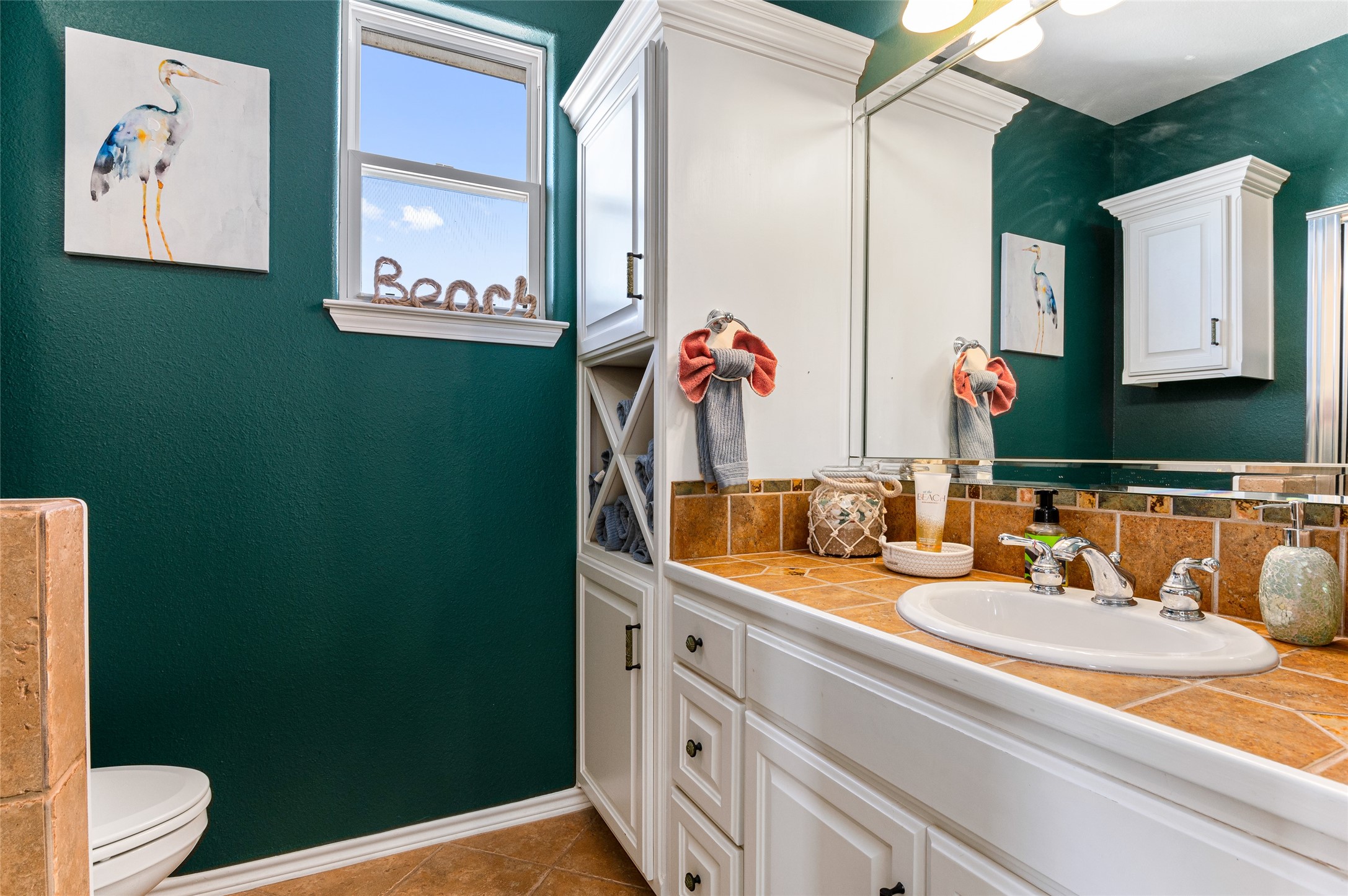 200 Mobile Crystal Beach, TX 77650 - Photo 36 of 49 a bathroom with a sink mirror and vanity