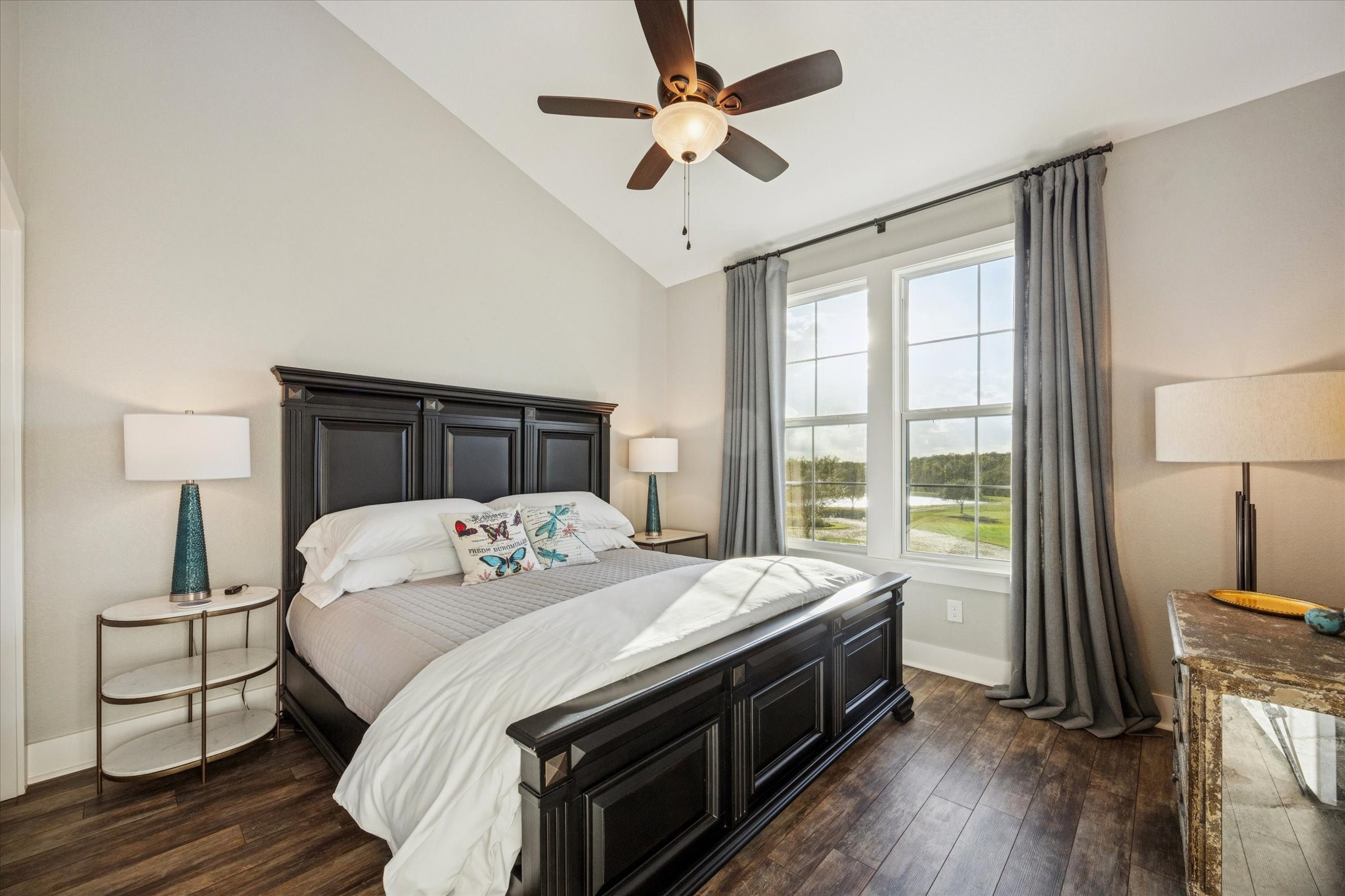 8611 Halamicek Loop Fayetteville, TX 78940 - Photo 25 of 41 a bedroom with a bed and a chandelier