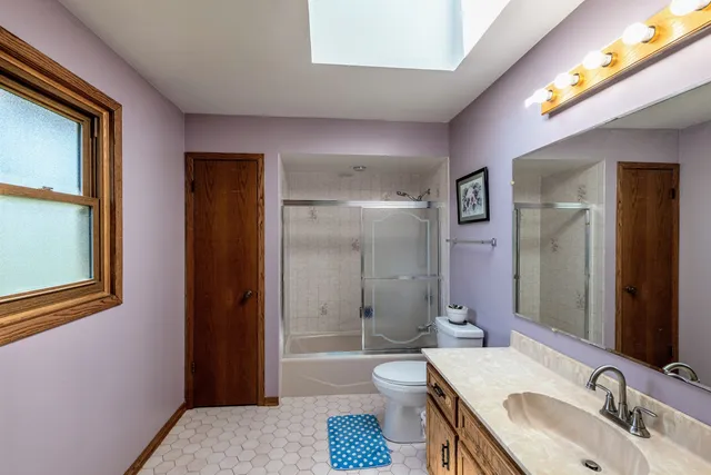 a bathroom with a toilet sink and shower