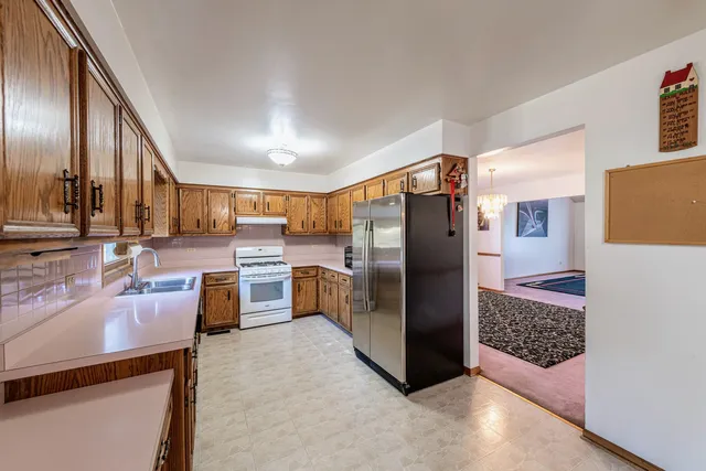 a kitchen with counter top space cabinets and stainless steel appliances