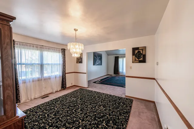 a view of a hallway with windows