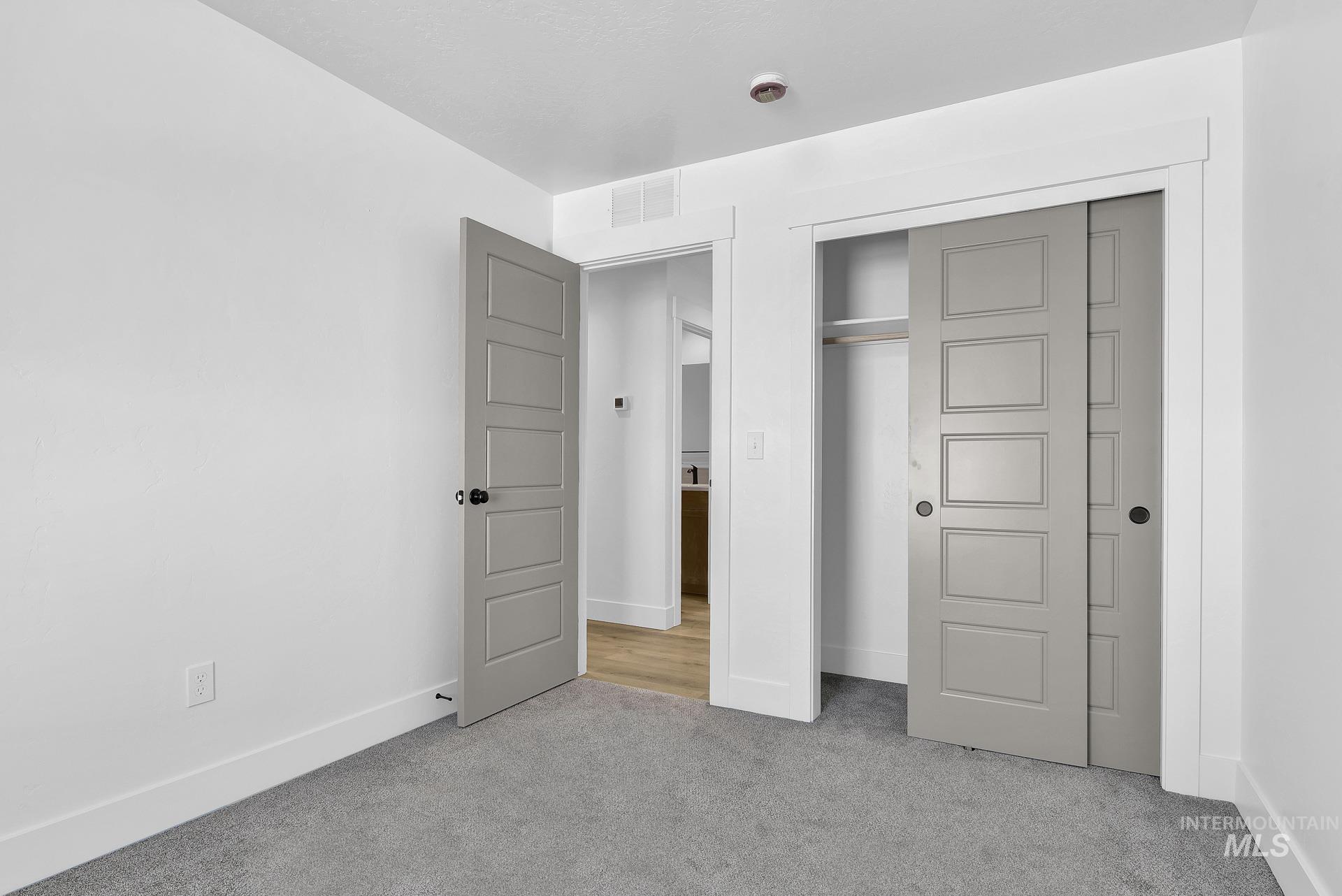 1162 Velvet Loop Wilder, ID 83676 - Photo 23 of 31 Unfurnished bedroom with light carpet and a closet