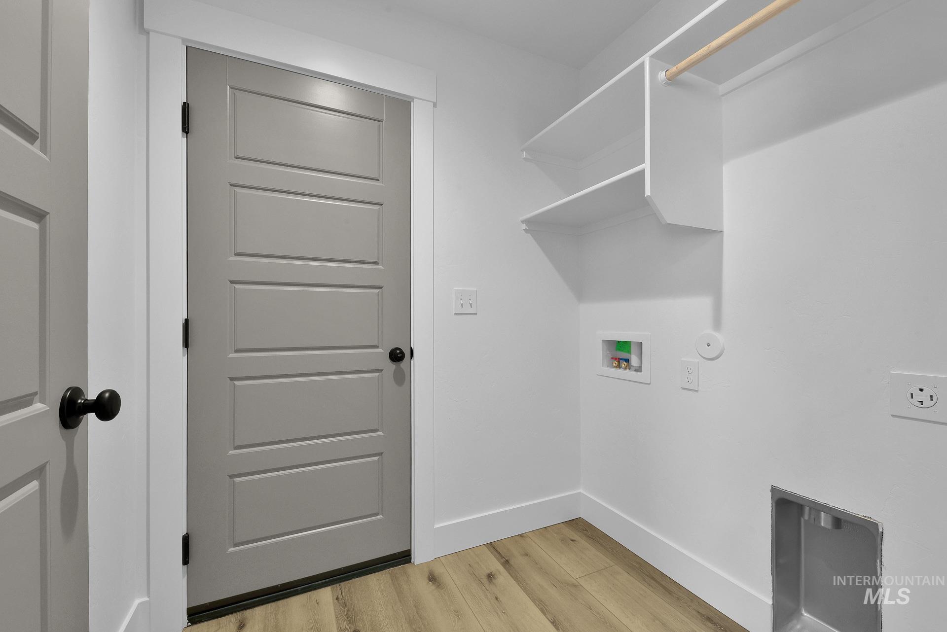 1162 Velvet Loop Wilder, ID 83676 - Photo 26 of 31 Laundry area featuring light wood-type flooring and washer hookup