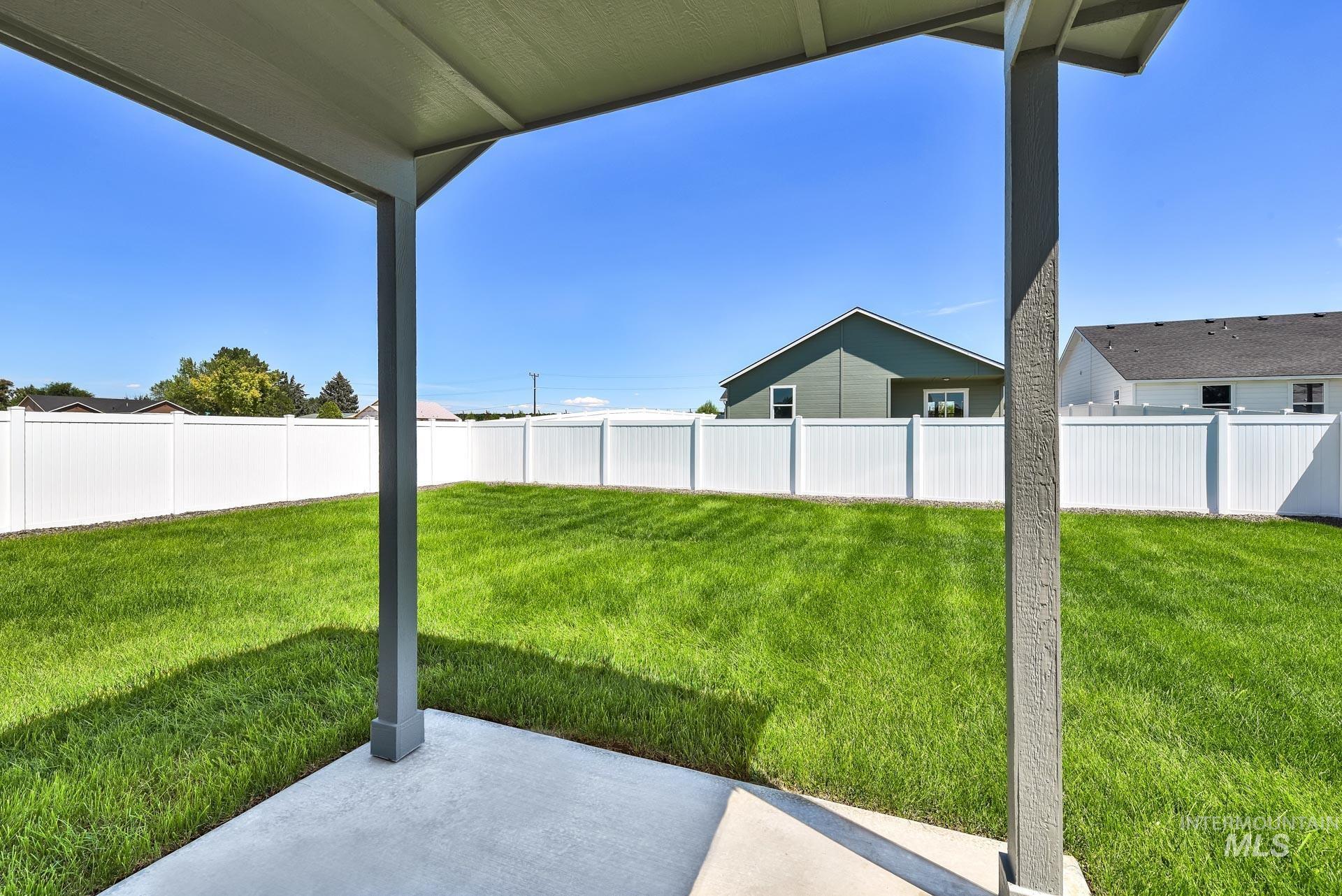 1162 Velvet Loop Wilder, ID 83676 - Photo 27 of 31 Fenced backyard with a patio area