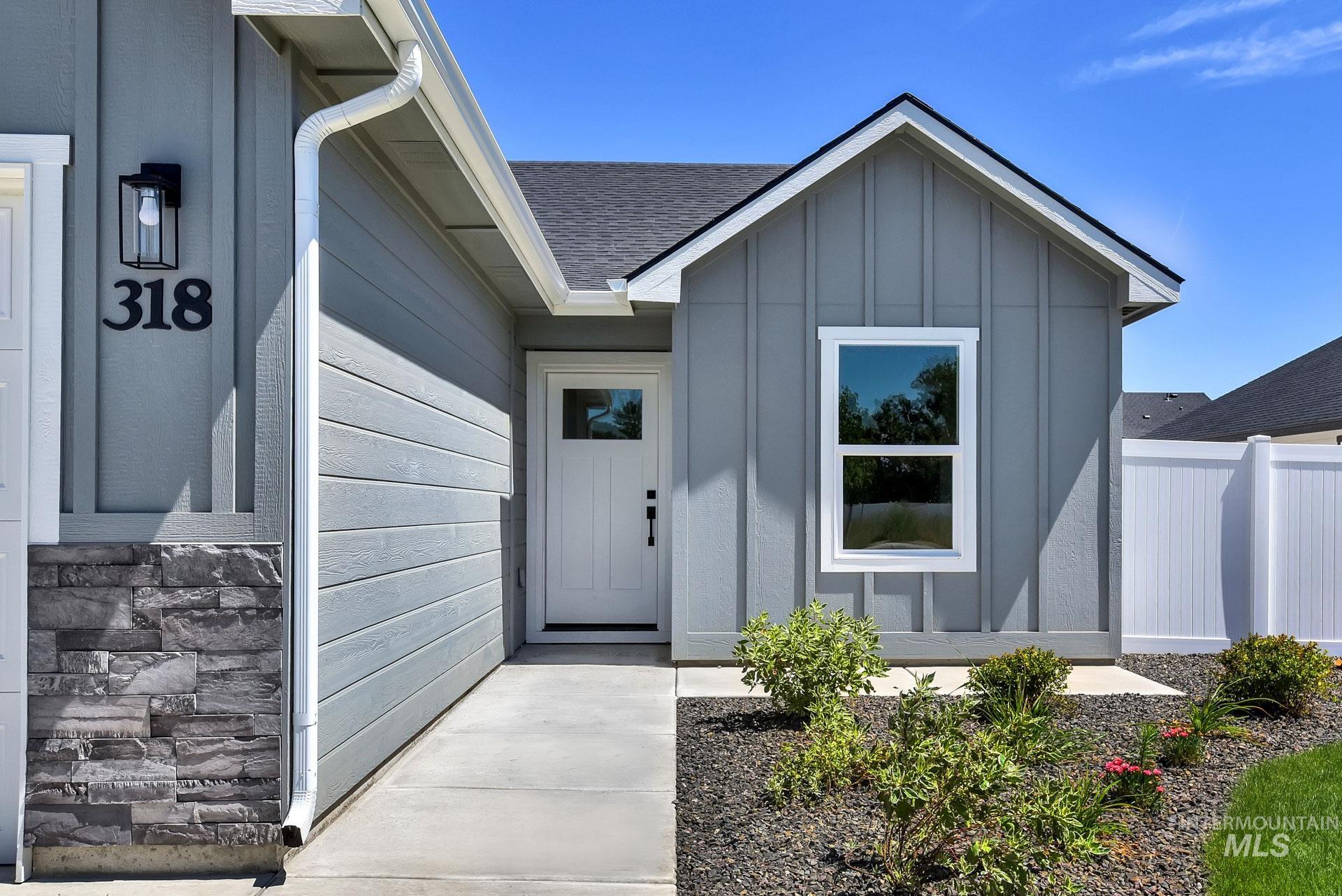 1162 Velvet Loop Wilder, ID 83676 - Photo 3 of 31 Property entrance featuring board and batten siding and a shingled roof