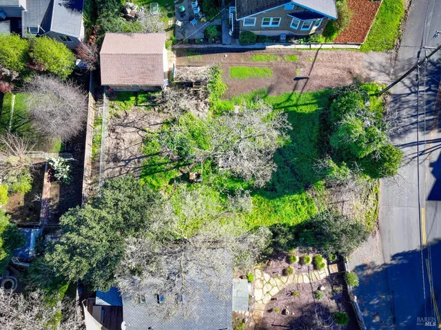 an aerial view of a house with a garden
