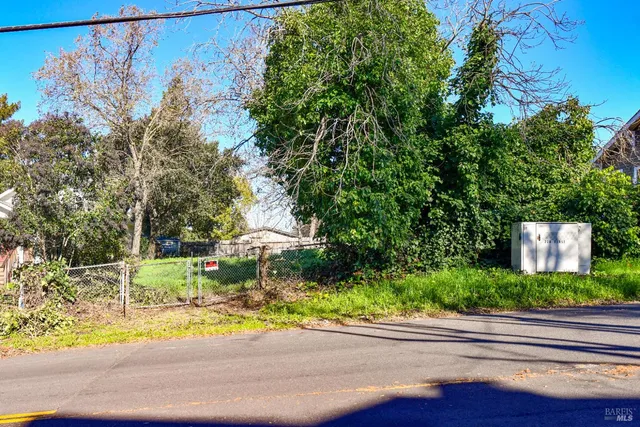 a view of a street with a building in the background