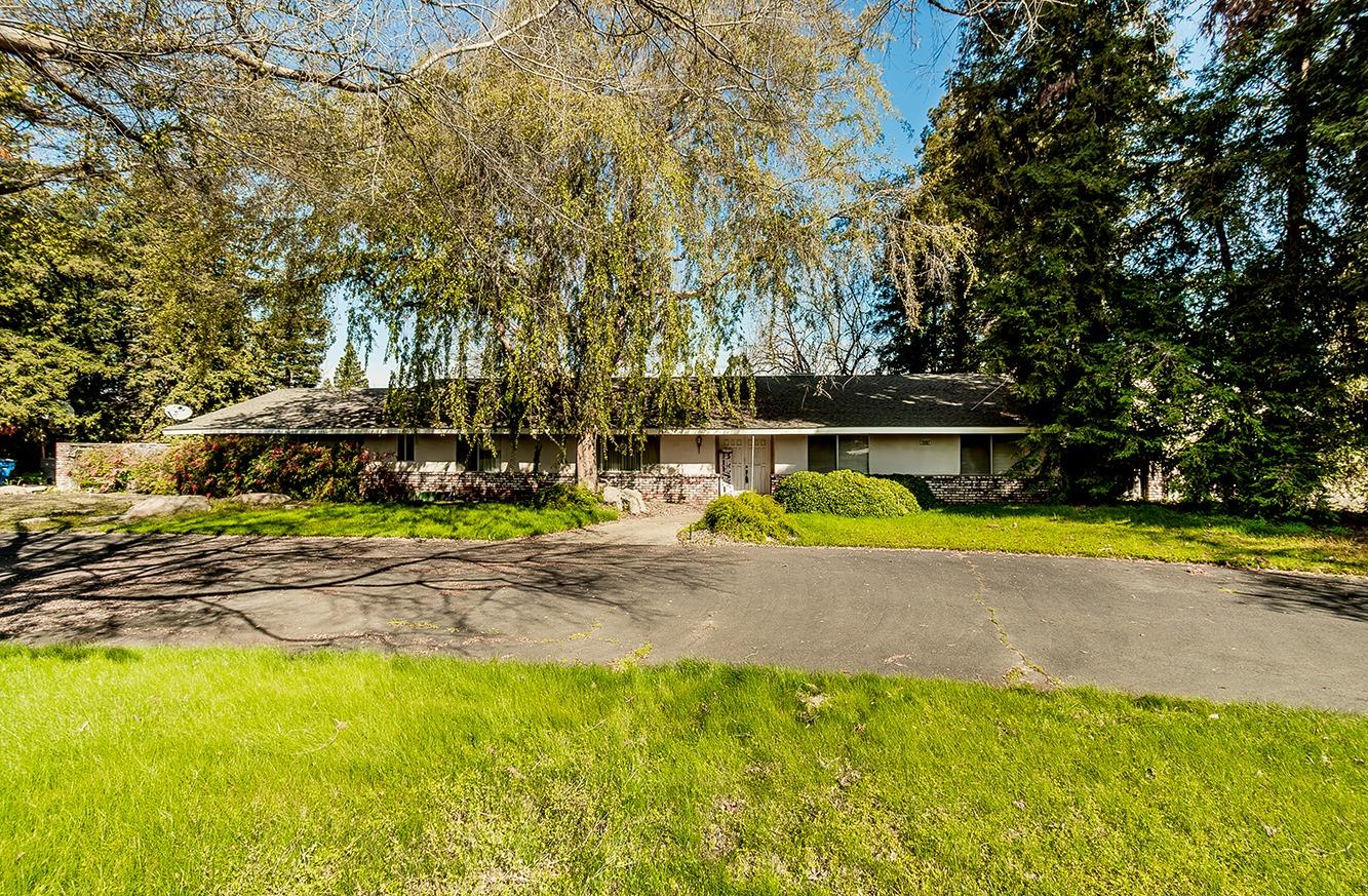 a view of a swimming pool with a patio and yard