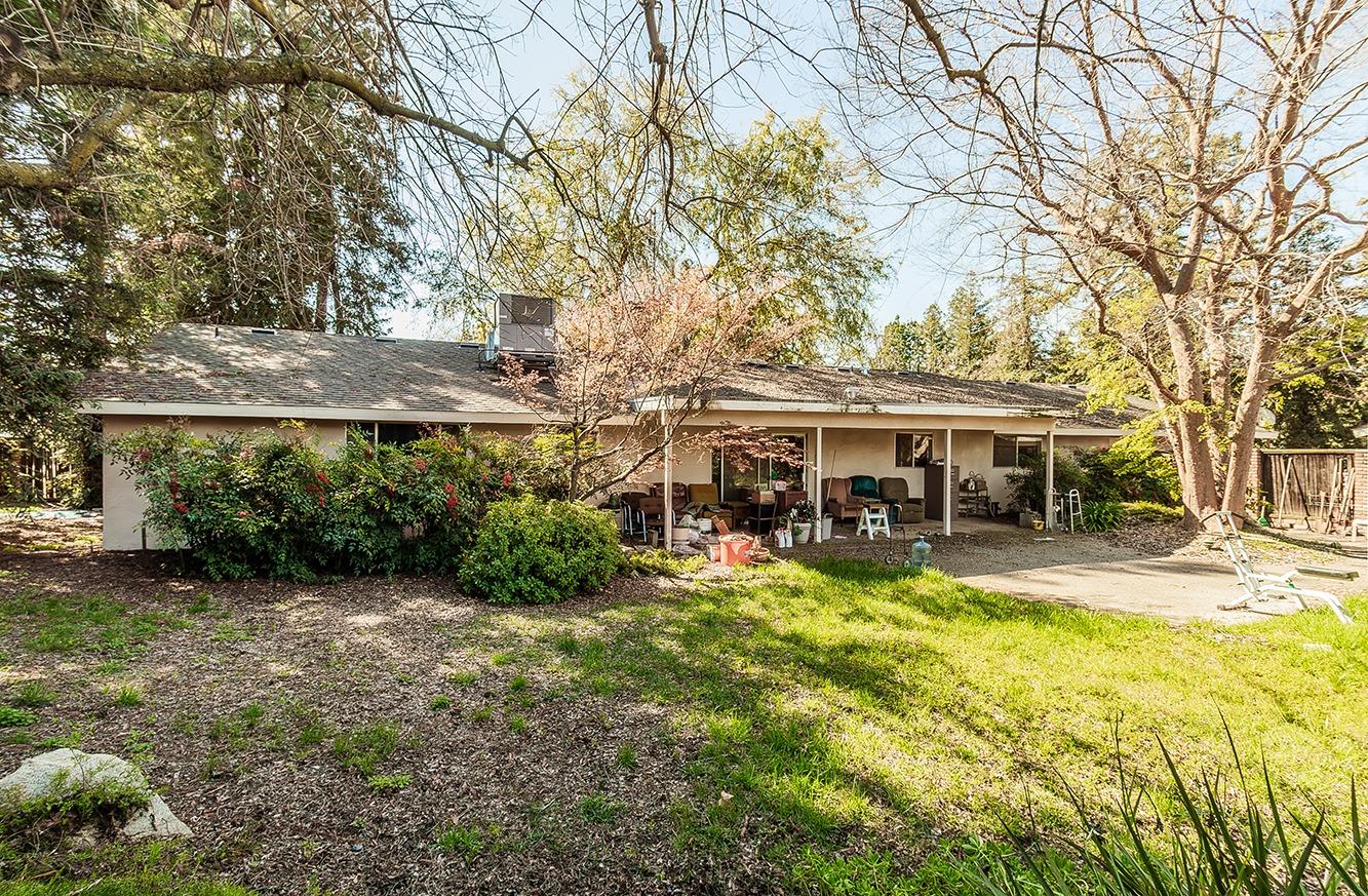 2501 Ashcroft Avenue Clovis, CA 93611 - Photo 18 of 24 a view of a yard with plants and trees