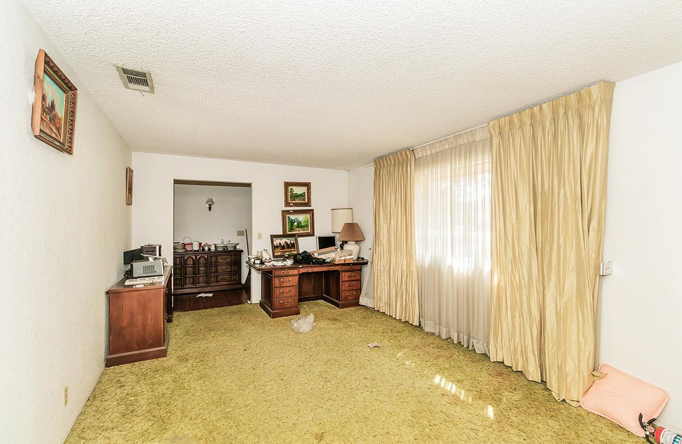 2501 Ashcroft Avenue Clovis, CA 93611 - Photo 3 of 24 a large room with furniture and natural light