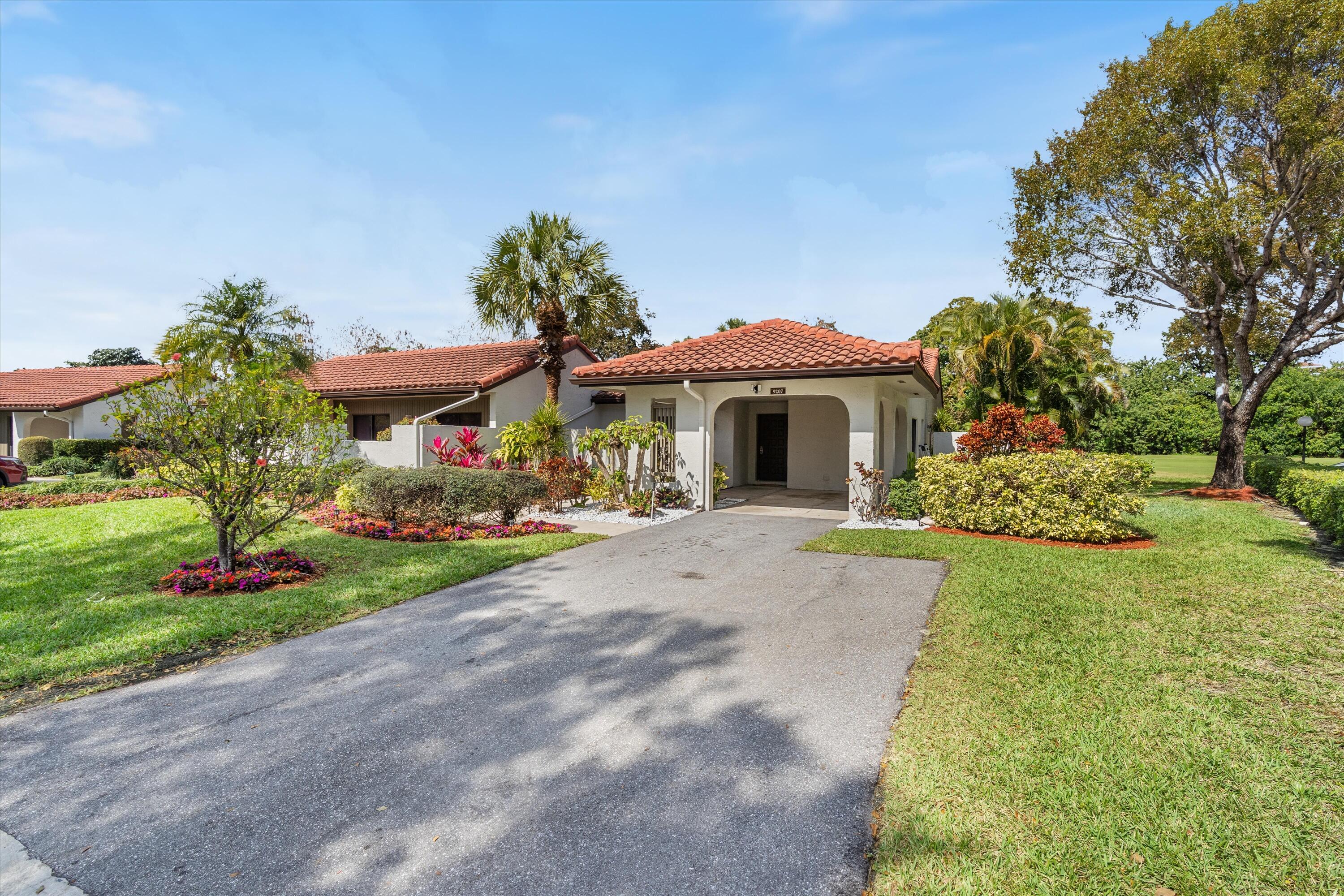 9207 Pecky Cypress Lane, Unit 9B Boca Raton, FL 33428 - Photo 3 of 29 Carport Area
