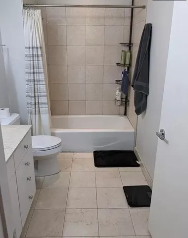 a bathroom with a toilet a sink and bathtub