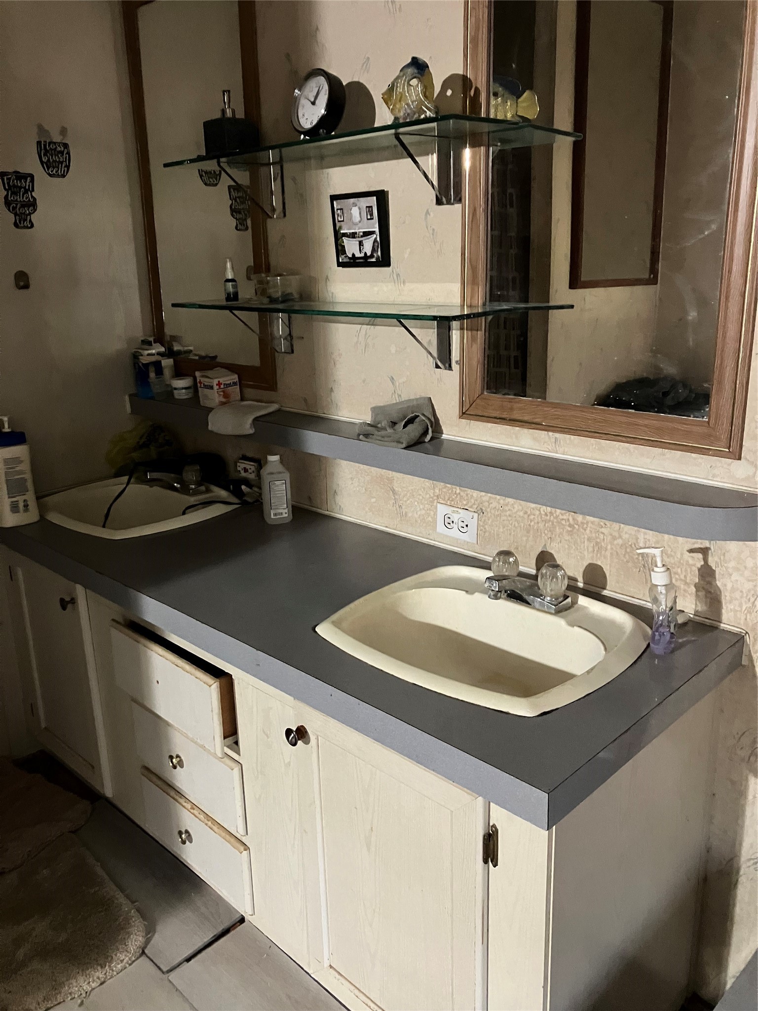 20923 Stevens Street New Caney, TX 77357 - Photo 14 of 20 a bathroom with a sink and a mirror